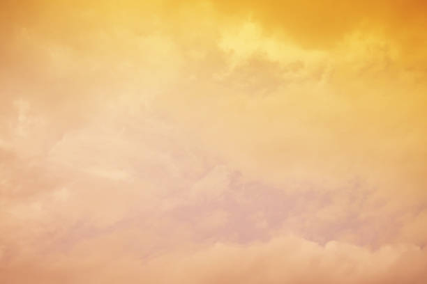 istock Nature background. Fluffy soft clouds in sky toned. 1046962398