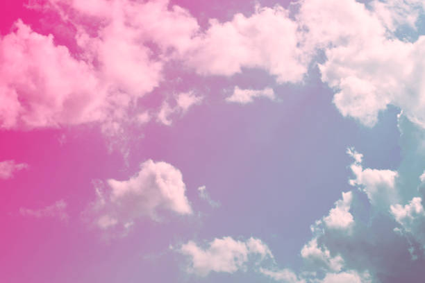 istock Nature background. Fluffy soft clouds in sky toned. 1046962502