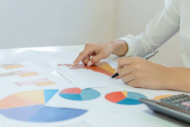 istock Businesswoman check profit document 1046973542
