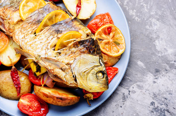 istock Fish baked with vegetable garnish 1046977146