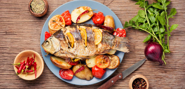 istock Fish baked with vegetable garnish 1046977190