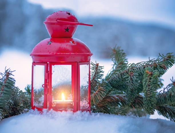 istock Christmas lantern with fir branches on snow 1046980292