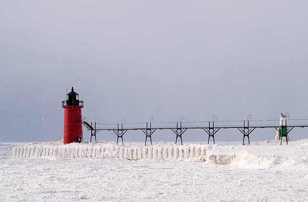 istock Snow storm over South Haven Lighthouse and Pier 104698203
