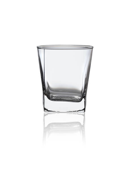 istock empty glass cup for strong alcoholic drinks and cocktails isolated on white background 1046982890