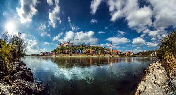 Burghausen, Bavaria, Germany: 180 degree panorama of the old town of Burghausen. View from Austria over the border river Salzach in late summertime.