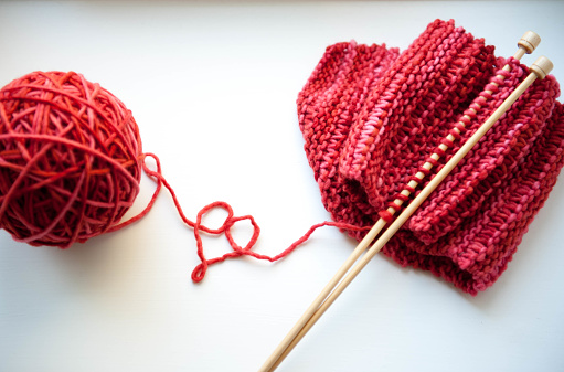 Knitting a red winter scarf