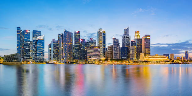 istock Singapore financial district skyline at Marina bay on twilight time. 1046995498