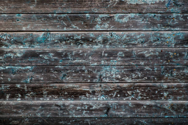 istock Cracked painted wooden background. 1046998216