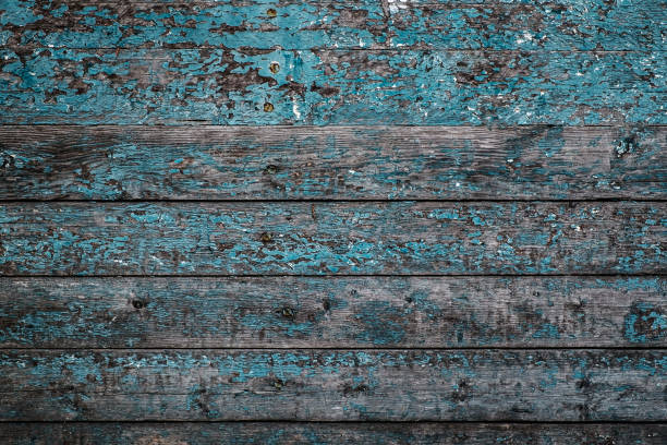 istock Cracked painted wooden background. 1046998238