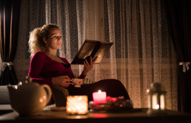 istock Woman doing research, paper work late at night. 1047000934