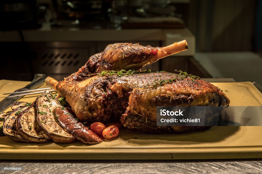 Carving Lamb Carving of Roasted lamb meat Baked Stock Photo