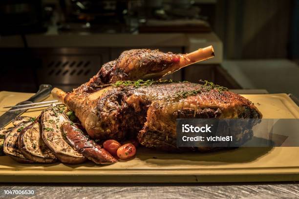 Carving Lamb Stock Photo - Download Image Now - Baked, Banquet, Barbecue Grill