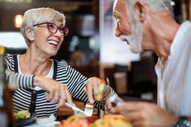 istock Active senior couple eating in the restaurant 1047007048