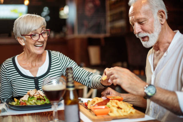 istock Senior couple eating in the restaurant 1047010004