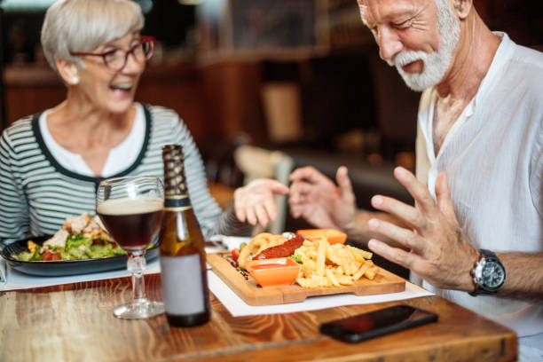 istock Senior couple eating in the restaurant 1047010114