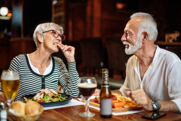 istock Senior couple eating in the restaurant 1047010136