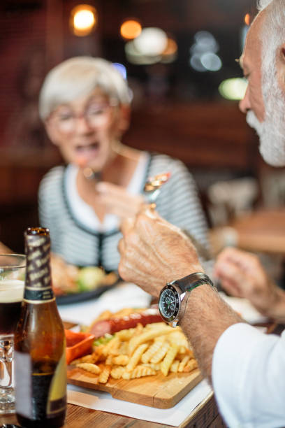 istock Senior couple eating in the restaurant 1047010616