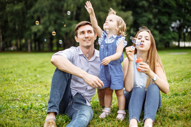 istock Family playing with bubbles outdoors. 1047010800