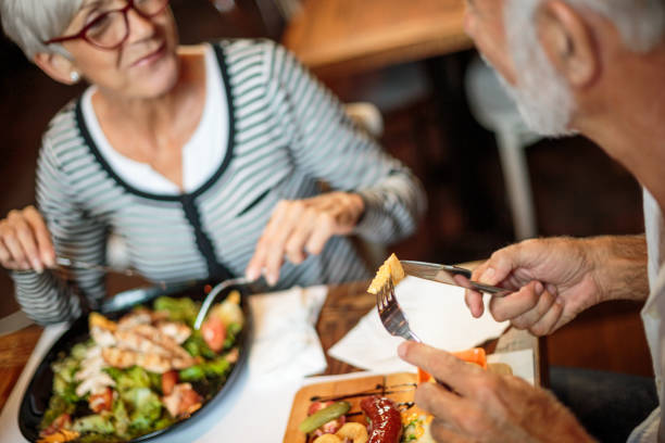 istock Senior couple eating in the restaurant 1047010932