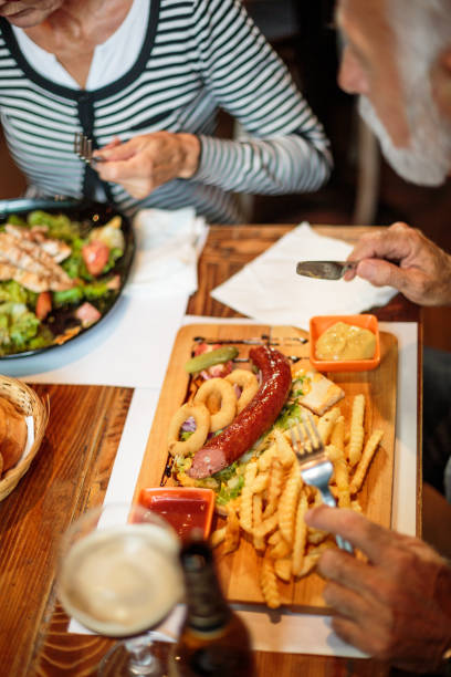 istock Senior couple eating in the restaurant 1047011134