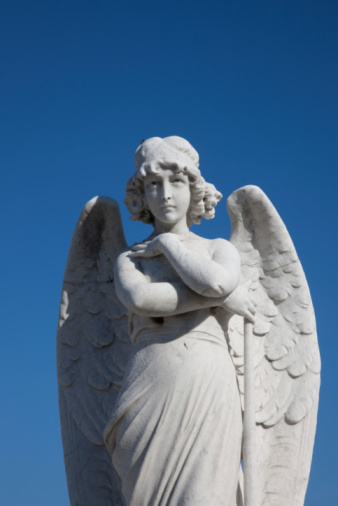 Angel in contemplation in Columbus(Colon) Cemetery, Havana.