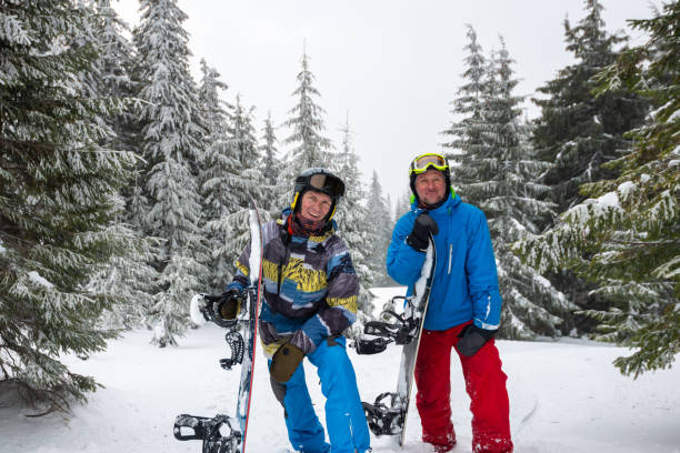 istock Joyful snowboarder smiling and looking into the camera 1047013392