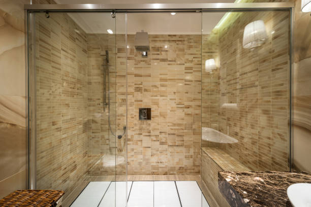 istock Shower cabin made of glass in bathroom interior 1047014232