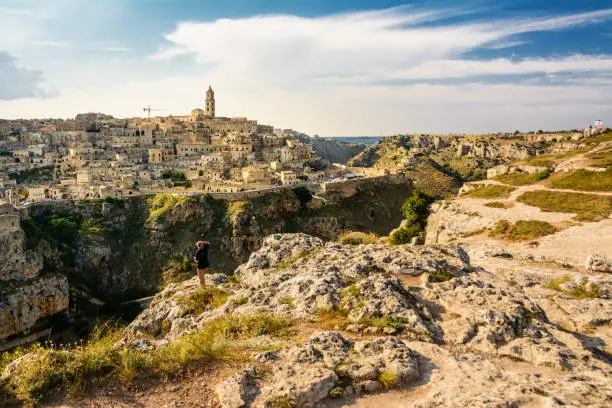 Matera, Italy - August 18, 2018: Tourists watching the Sassi di Matera from the opposite hill
