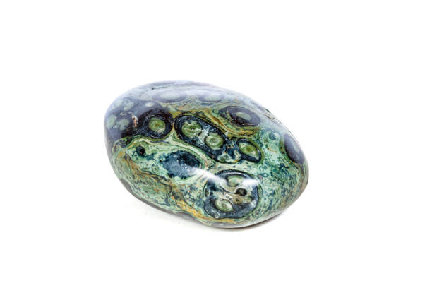 istock Macro mineral stone jasper kambaba on a white background 1047016764