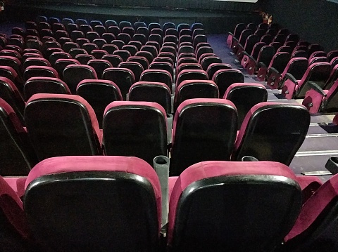 Row of Empty red cinema or theater seats