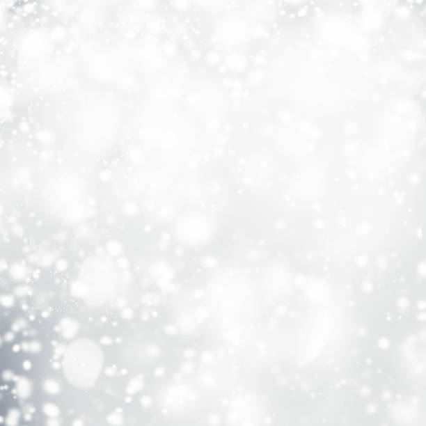 istock Silver  abstract bokeh background with snowflake and white glittering bokeh stars. A shiny holiday card. Glowing blurred lights