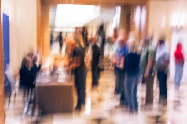 istock Blurry background participants check-in and queue  at registration table of conference 1047019842