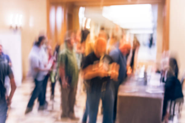 istock Blurry background participants check-in and queue  at registration table of conference 1047020042