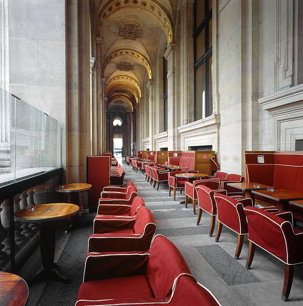 Beautiful old interior of Parisian stately building with dining table and chairs