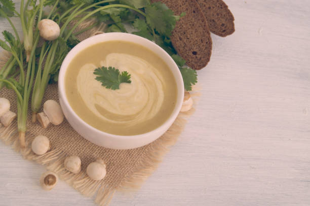 istock Homemade diet mushroom soup on a light background. 1047027618