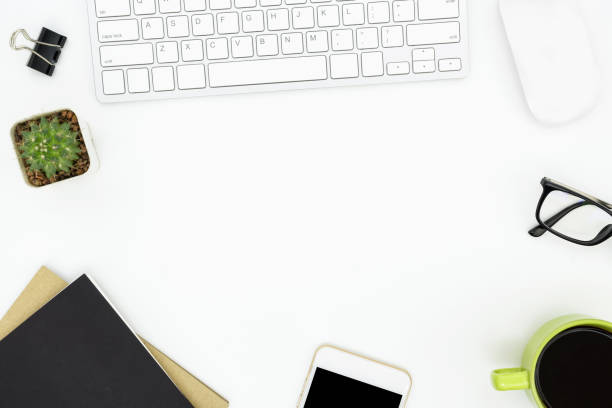 istock White office desk table with computer gadgets and office supplies. Top view with copy space, flat lay. 1047027640