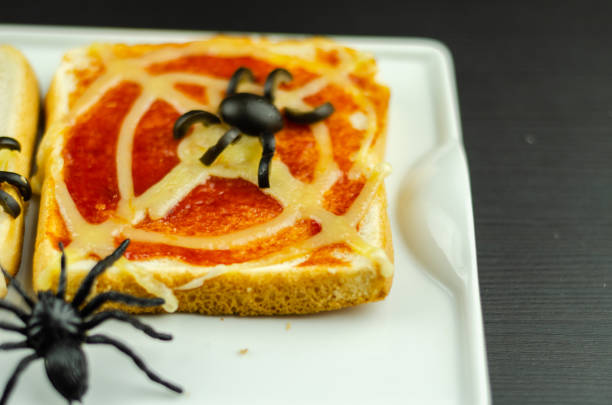 istock Funny sandwiches with  spider and  spider web for Halloween party 1047027988