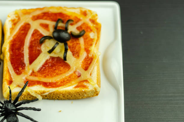istock Funny sandwiches with  spider and  spider web for Halloween party 1047028290