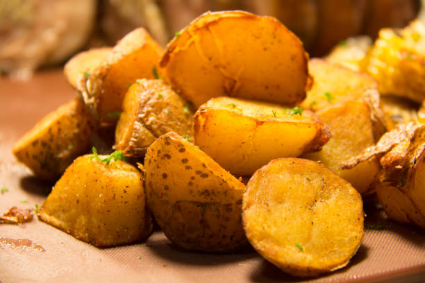 istock Baked potato wedges with rosemary 1047030930