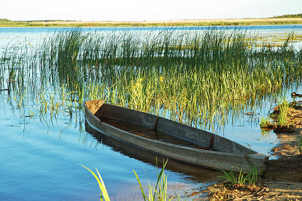 istock Beautiful lake and old boat 104703381