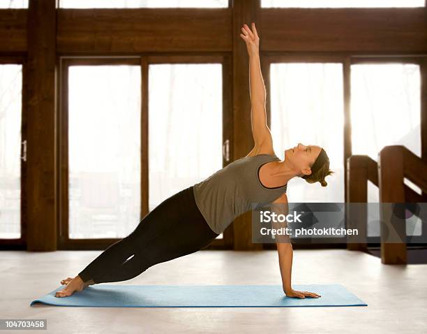 Woman Holding Yoga Positions Stock Photo - Download Image Now - Adult, Aerobics, Back Lit