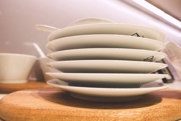 istock Closeup of white plates and dinnerware display on shelf 1047034666