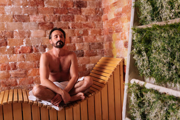 istock Nice bearded man trying to relax in sauna 1047034678