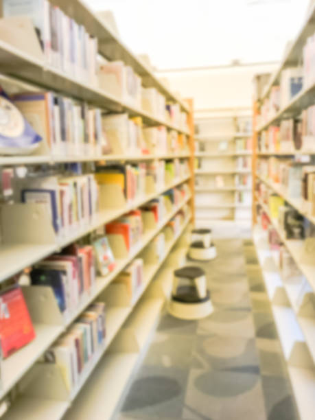 istock Blurry background bookshelf with step stool at public library in Texas, America 1047035660