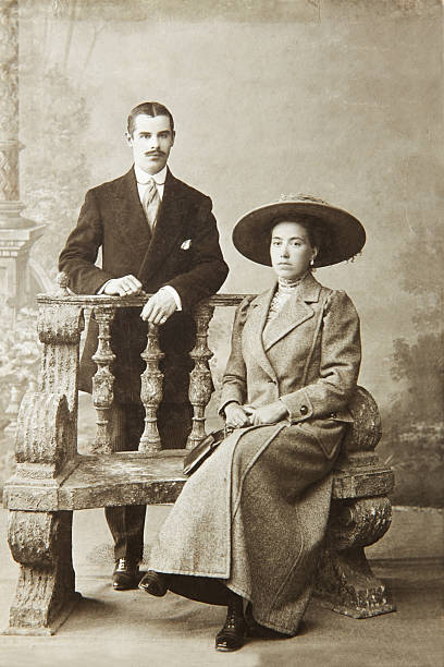 Antique Photo Of A Woman Seated And A Man Standing Stock Photo ...