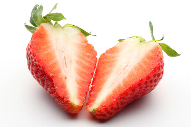 istock Strawberries with leaves isolated on white 1047042192