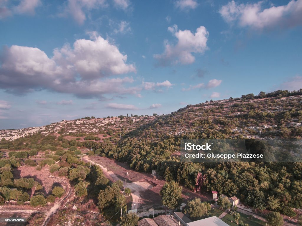 Aerial view of the "Cava", a natural cave in Sicily during a summer day afternoon Above Stock Photo