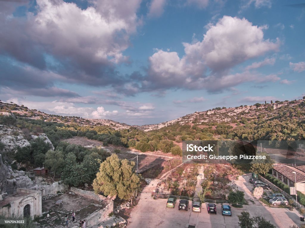 Aerial view of the "Cava", a natural cave in Sicily during a summer day afternoon Aerial View Stock Photo