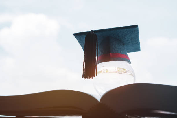istock Education in Global; Graduation cap on top crystal ball on textbook. 1047047900
