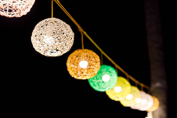 istock Hanging colorful lamps in a dark night 1047047916